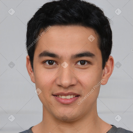 Joyful asian young-adult male with short  black hair and brown eyes