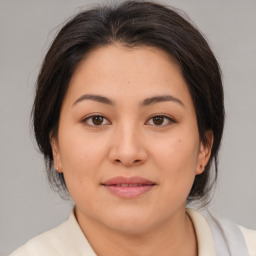 Joyful white young-adult female with medium  brown hair and brown eyes