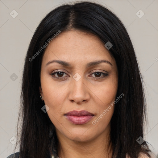 Joyful latino young-adult female with long  brown hair and brown eyes