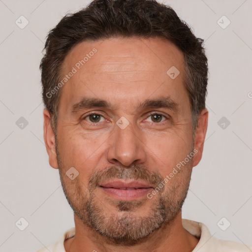 Joyful white adult male with short  brown hair and brown eyes