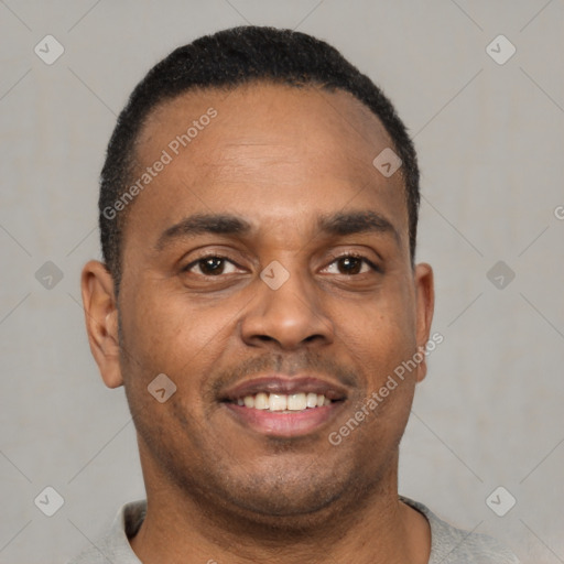 Joyful latino young-adult male with short  brown hair and brown eyes