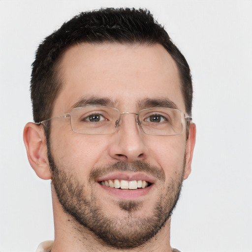 Joyful white young-adult male with short  brown hair and brown eyes