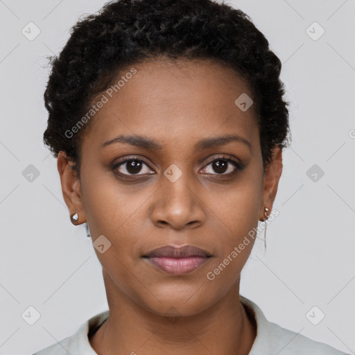 Joyful black young-adult female with short  black hair and brown eyes