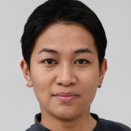 Joyful asian young-adult female with short  black hair and brown eyes