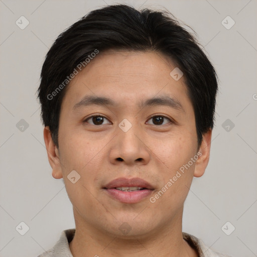 Joyful asian young-adult male with short  brown hair and brown eyes