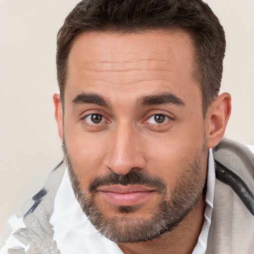 Joyful white young-adult male with short  brown hair and brown eyes