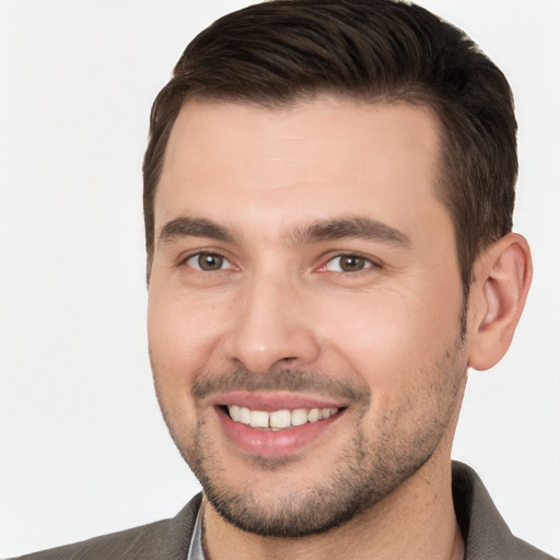 Joyful white young-adult male with short  brown hair and brown eyes