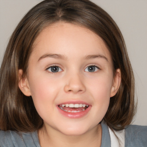 Joyful white child female with medium  brown hair and brown eyes