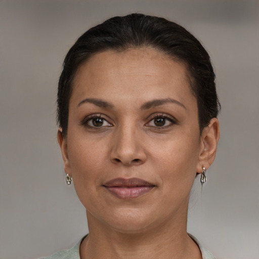 Joyful white adult female with short  brown hair and brown eyes