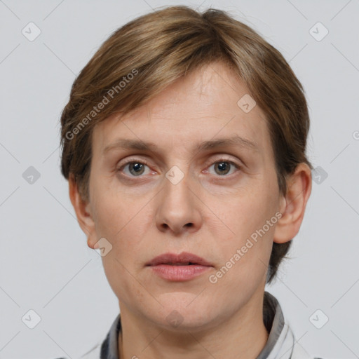 Joyful white adult female with short  brown hair and grey eyes