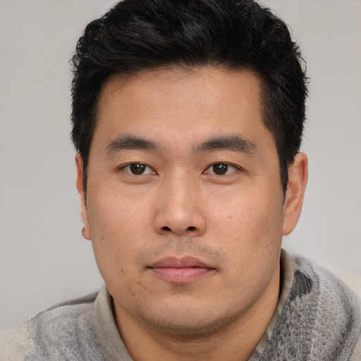 Neutral asian young-adult male with short  black hair and brown eyes