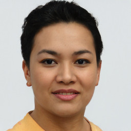 Joyful asian young-adult female with short  brown hair and brown eyes