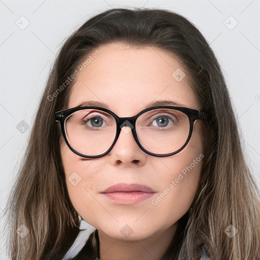 Joyful white young-adult female with long  brown hair and blue eyes