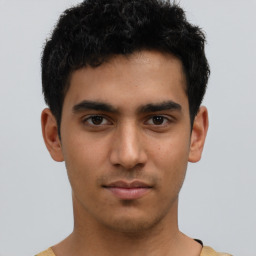 Neutral latino young-adult male with short  brown hair and brown eyes