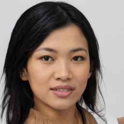 Joyful asian young-adult female with medium  black hair and brown eyes