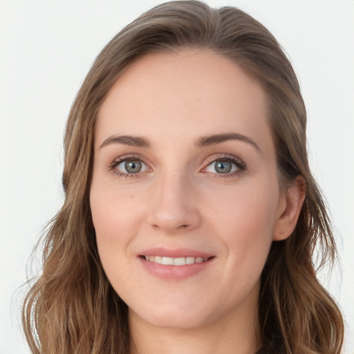 Joyful white young-adult female with long  brown hair and blue eyes