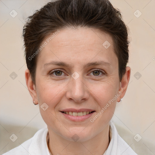 Joyful white adult female with short  brown hair and brown eyes