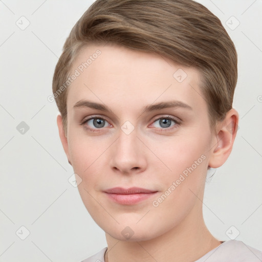 Joyful white young-adult female with short  brown hair and grey eyes