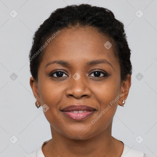 Joyful black young-adult female with short  brown hair and brown eyes