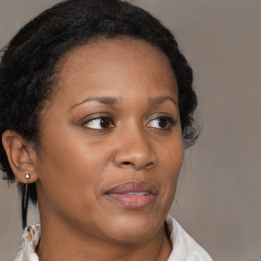 Neutral black young-adult female with medium  brown hair and brown eyes