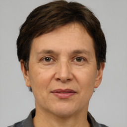 Joyful white adult female with short  brown hair and brown eyes