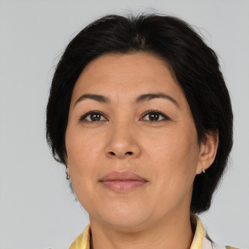 Joyful asian adult female with medium  brown hair and brown eyes