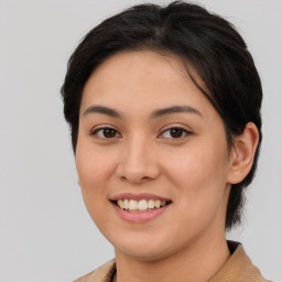 Joyful white young-adult female with medium  brown hair and brown eyes