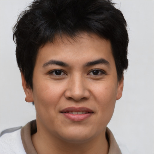 Joyful asian young-adult male with short  brown hair and brown eyes