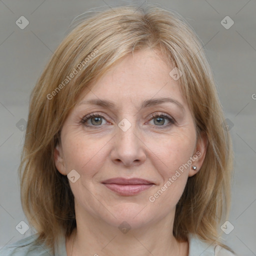 Joyful white adult female with medium  brown hair and grey eyes