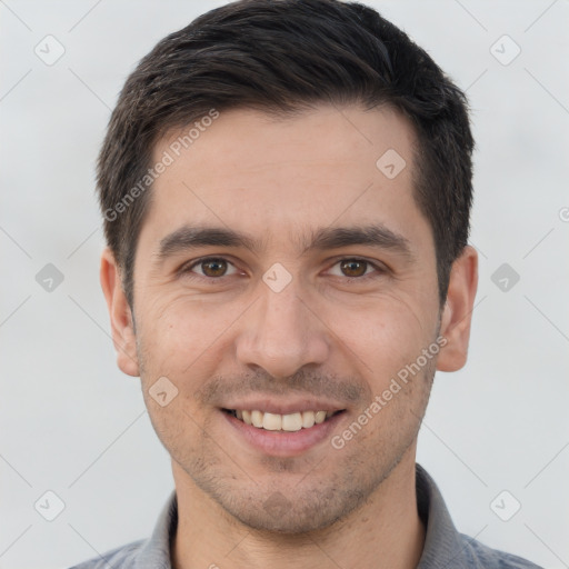 Joyful white young-adult male with short  brown hair and brown eyes