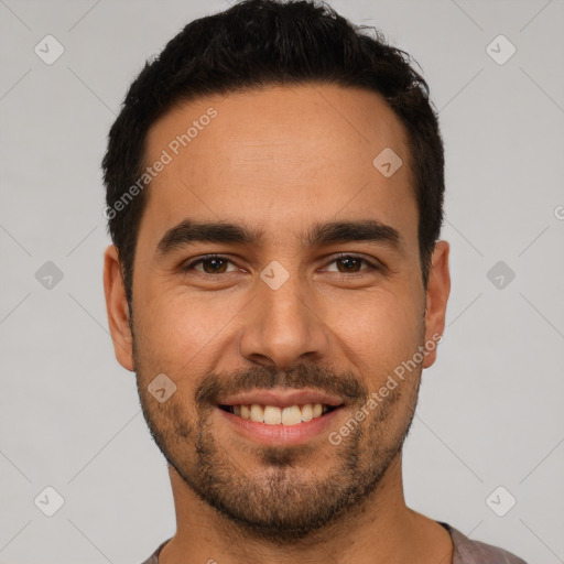 Joyful white young-adult male with short  black hair and brown eyes