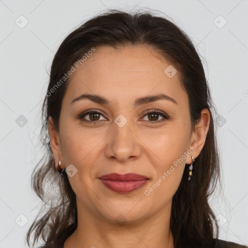 Joyful white adult female with long  brown hair and brown eyes