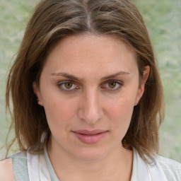 Joyful white young-adult female with medium  brown hair and blue eyes