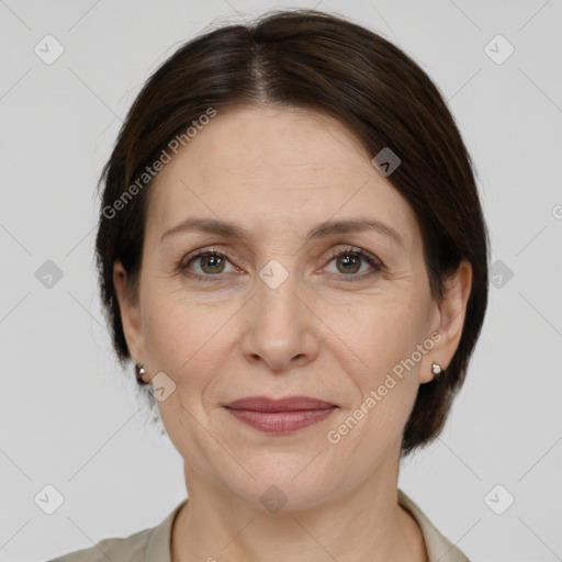 Joyful white adult female with medium  brown hair and grey eyes