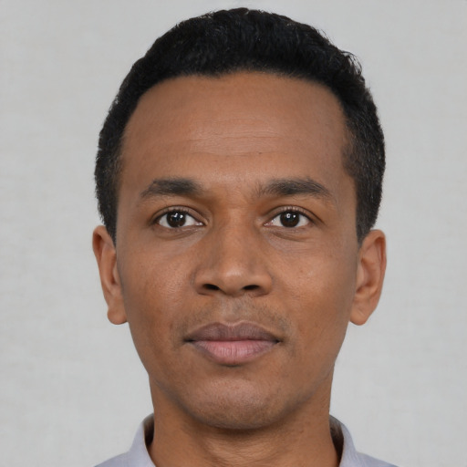 Neutral black young-adult male with short  black hair and brown eyes