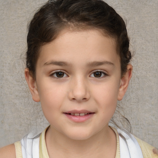 Joyful white child female with short  brown hair and brown eyes