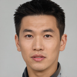 Neutral asian young-adult male with short  black hair and brown eyes