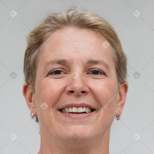 Joyful white adult female with short  brown hair and grey eyes