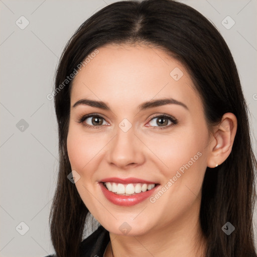 Joyful white young-adult female with long  brown hair and brown eyes