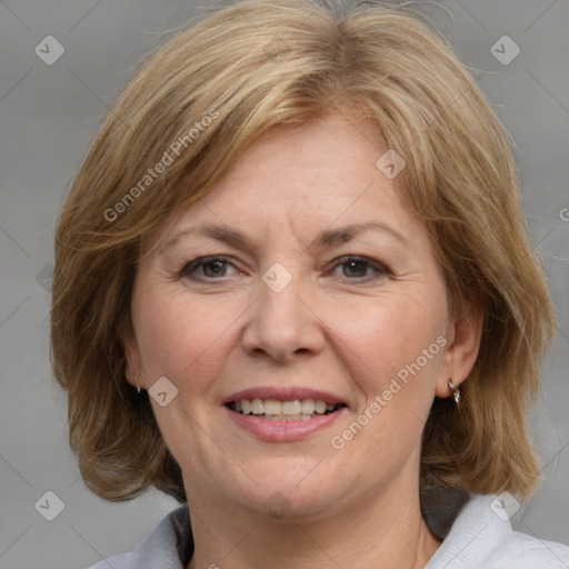 Joyful white adult female with medium  brown hair and grey eyes