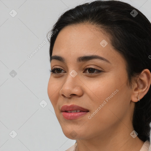 Joyful asian young-adult female with long  brown hair and brown eyes