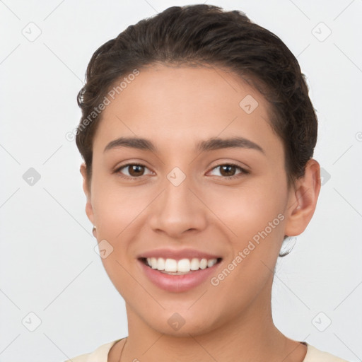 Joyful white young-adult female with short  brown hair and brown eyes