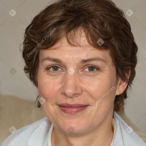 Joyful white adult female with medium  brown hair and green eyes