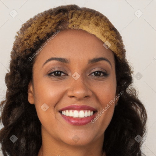 Joyful black young-adult female with long  brown hair and brown eyes