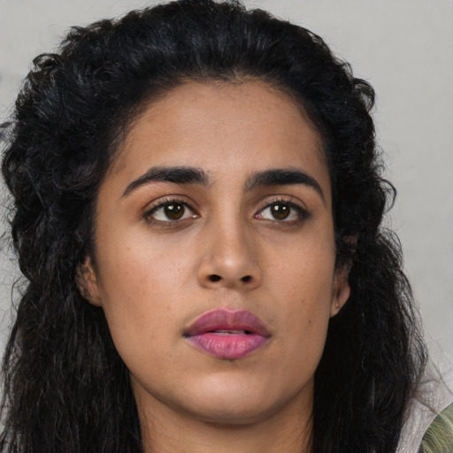 Neutral latino young-adult female with long  black hair and brown eyes