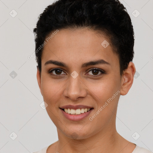 Joyful latino young-adult female with short  brown hair and brown eyes