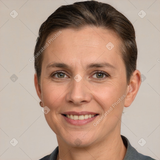 Joyful white adult female with short  brown hair and brown eyes