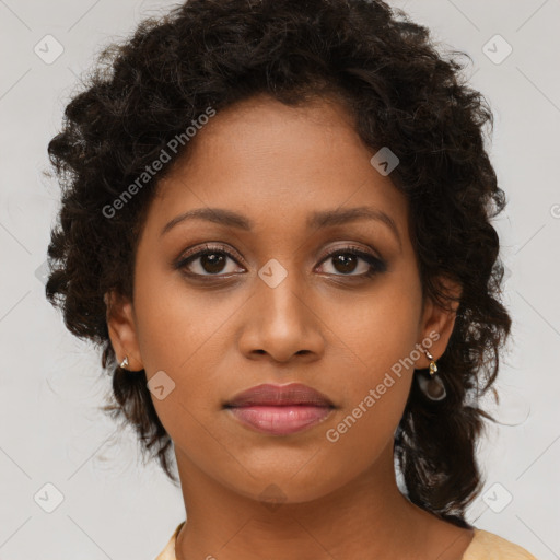 Joyful black young-adult female with medium  brown hair and brown eyes