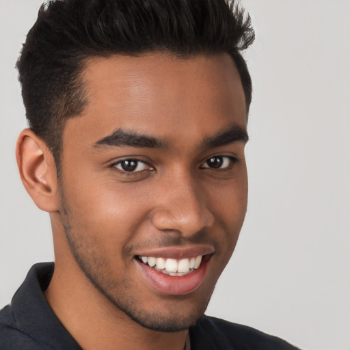 Joyful white young-adult male with short  black hair and brown eyes