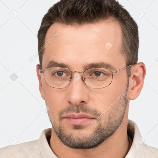 Neutral white adult male with short  brown hair and brown eyes